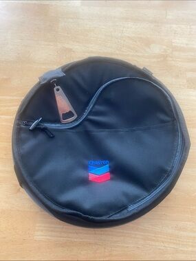 Round insulated Chevron branded cooler bag 13 across 9 in high Folds to store